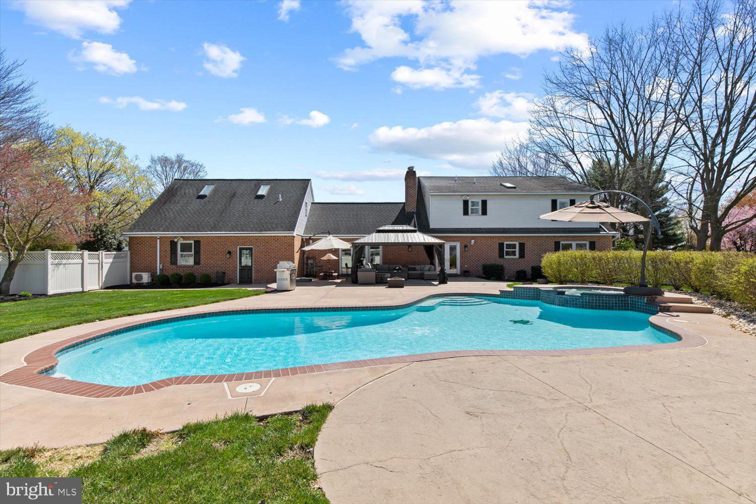 702 Buckwood Lane Lititz, PA 17543 - Photo 57 of 64 a front view of a house with a yard and garage