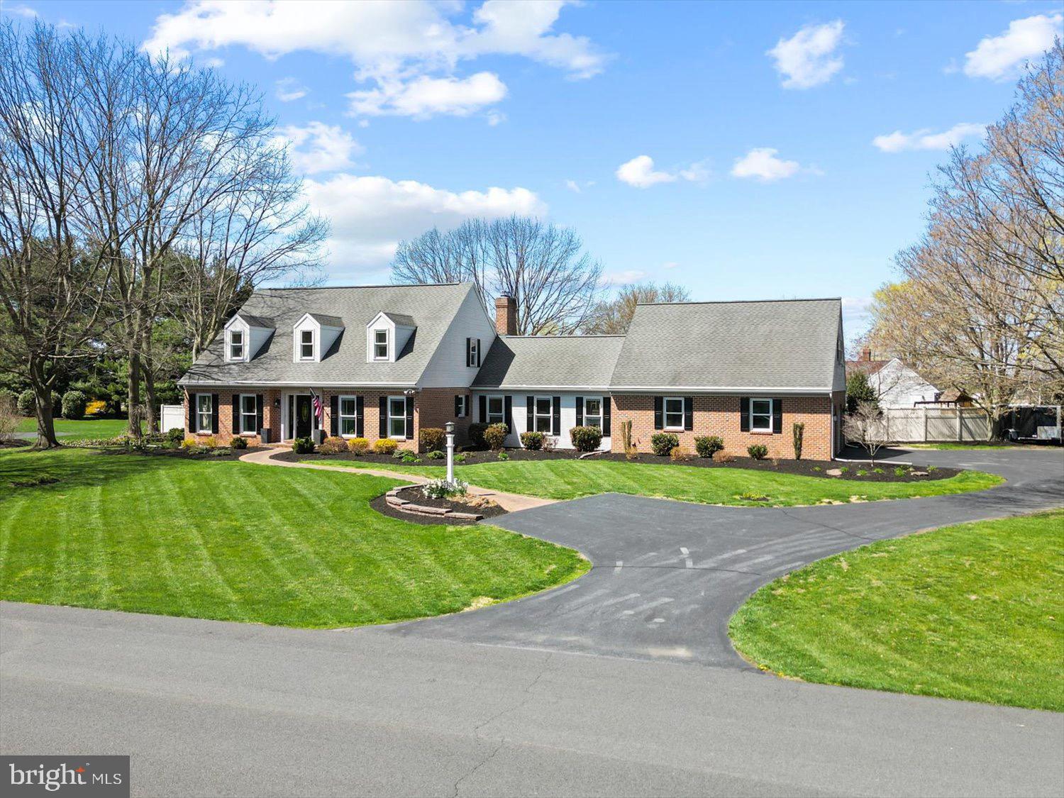 702 Buckwood Lane Lititz, PA 17543 - Photo 59 of 64 a view of a big house with a big yard and potted plants