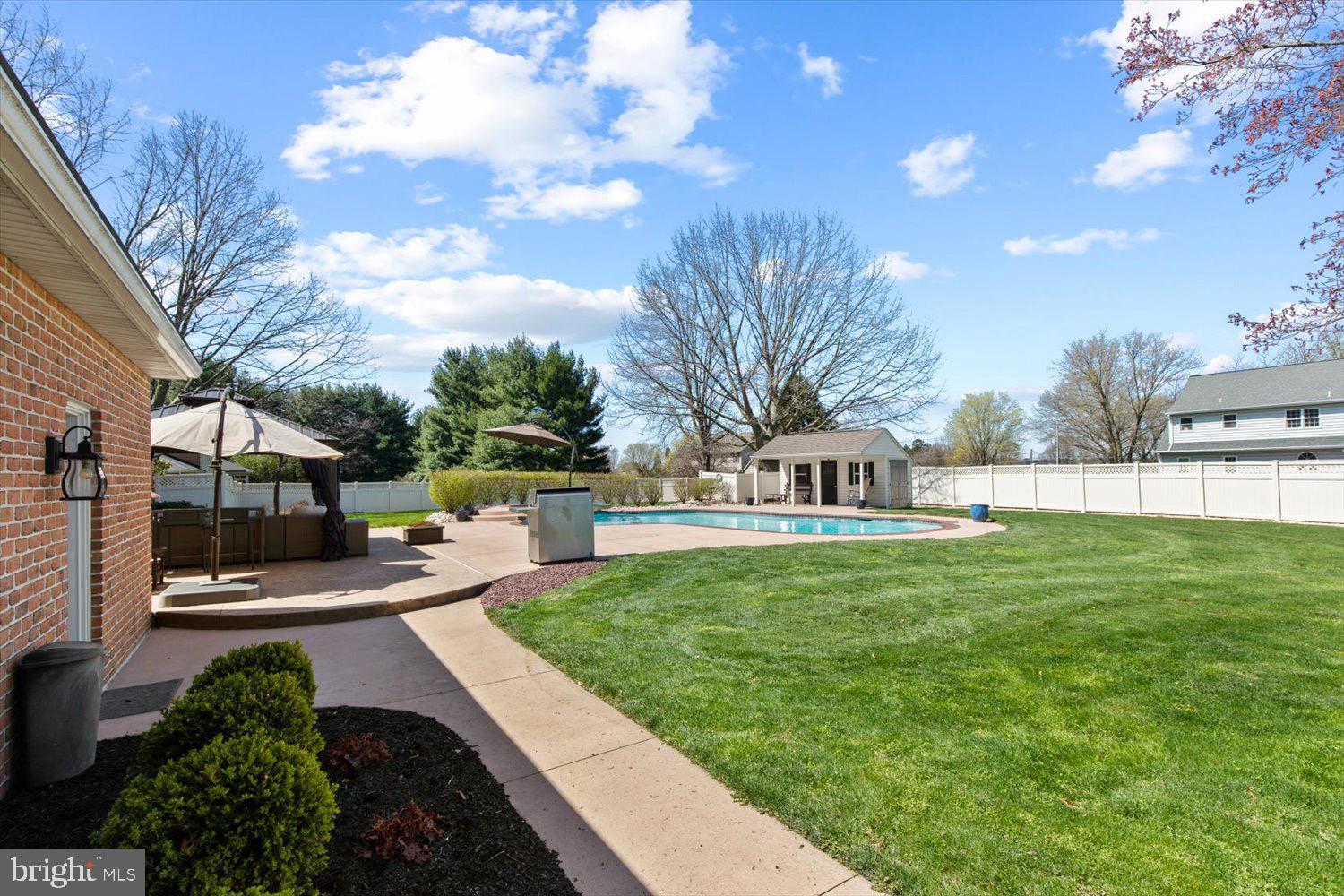702 Buckwood Lane Lititz, PA 17543 - Photo 7 of 64 a view of a patio with table and chairs potted plants and a large tree