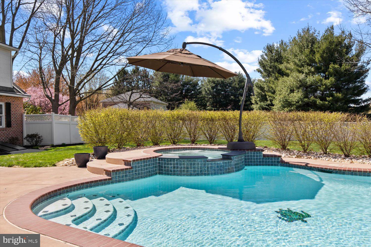 702 Buckwood Lane Lititz, PA 17543 - Photo 8 of 64 a view of a swimming pool with a patio