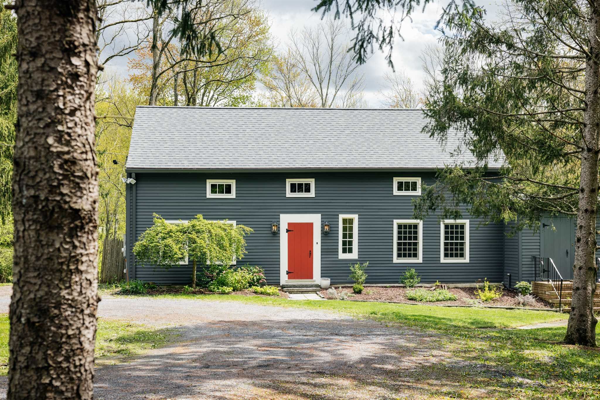 a front view of a house with garden