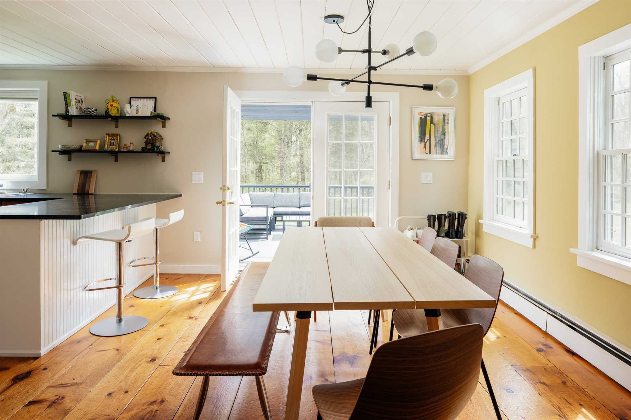 89 Benner Road Red Hook, NY 12571 - Photo 12 of 33 a dining room with wooden floor and a window