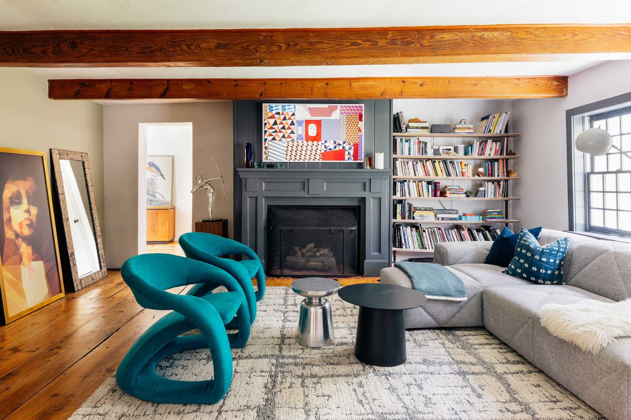 89 Benner Road Red Hook, NY 12571 - Photo 3 of 33 a living room with furniture a fireplace and a flat screen tv