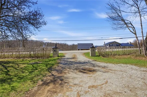 a view of a big yard with a fountain