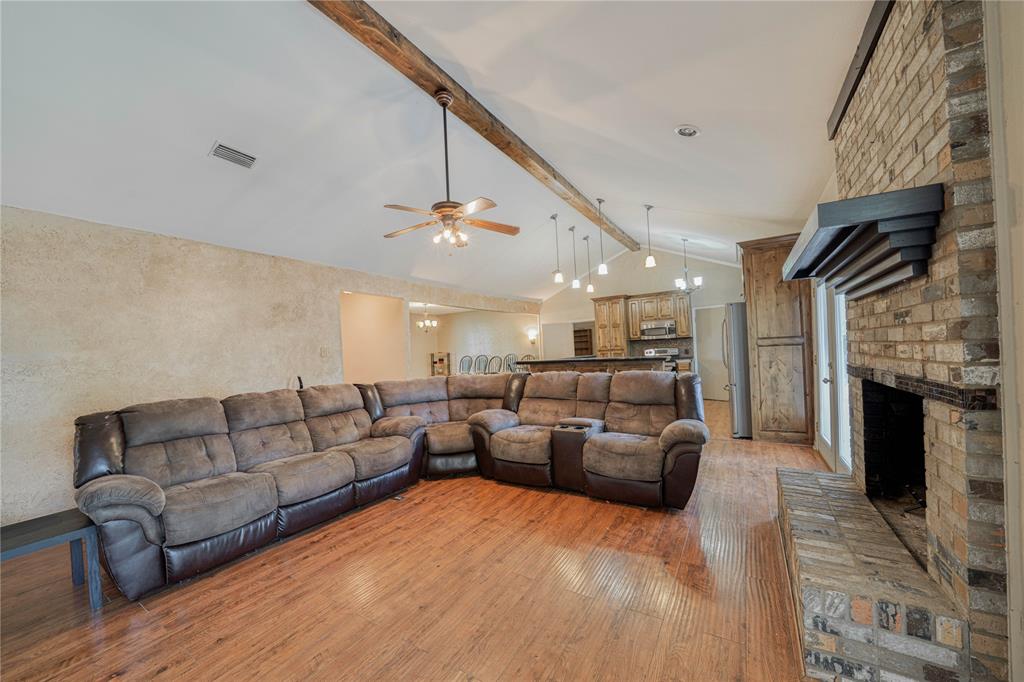 1006 Rikkity Lane Mount Pleasant, TX 75455 - Photo 4 of 39 a living room with furniture and a fireplace