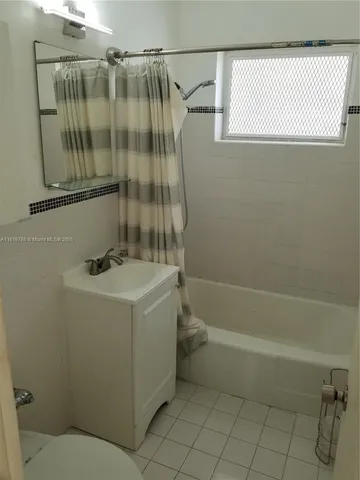 view of a room with a refrigerator