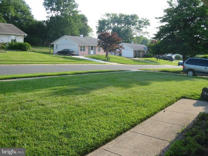 1916 Juniper Road Edgewood, MD 21040 - Photo 5 of 6 a front view of a house with a yard and trees