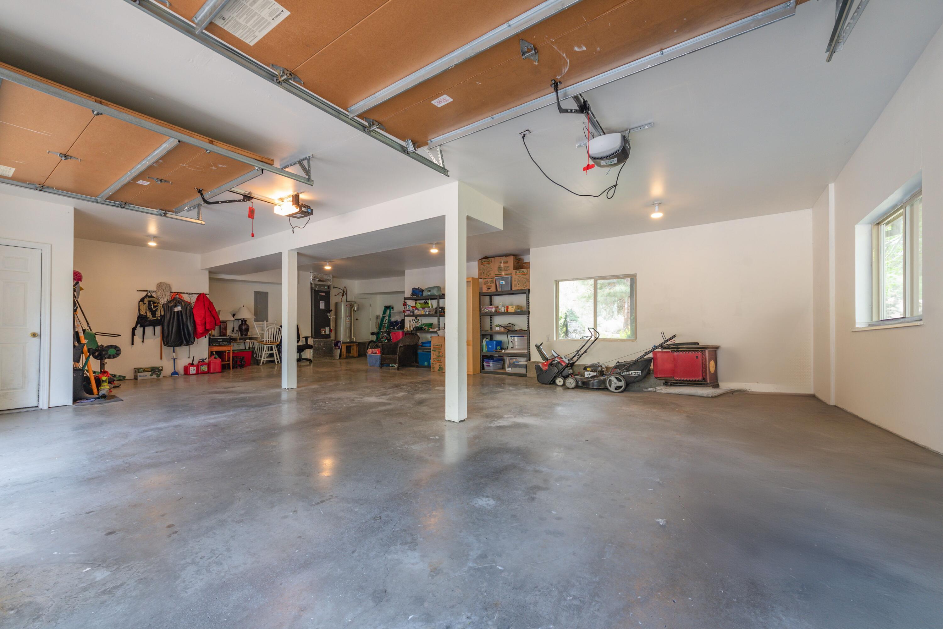 2255 Northwest Putnam Road Bend, OR 97703 - Photo 36 of 49 The 1000 SF garage has two garage doors and a big extra space for a workshop, storage or potentially room for a 3rd car via tandem.