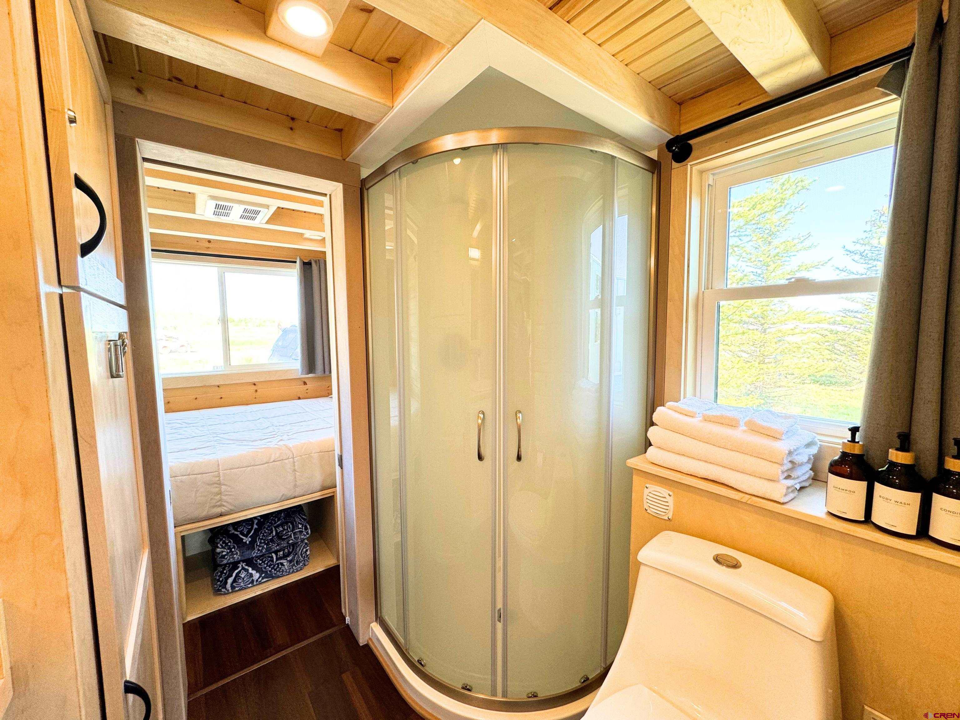 22130 6850 Road, Unit 213 Montrose, CO 81403 - Photo 7 of 26 a bathroom with a sink and a mirror