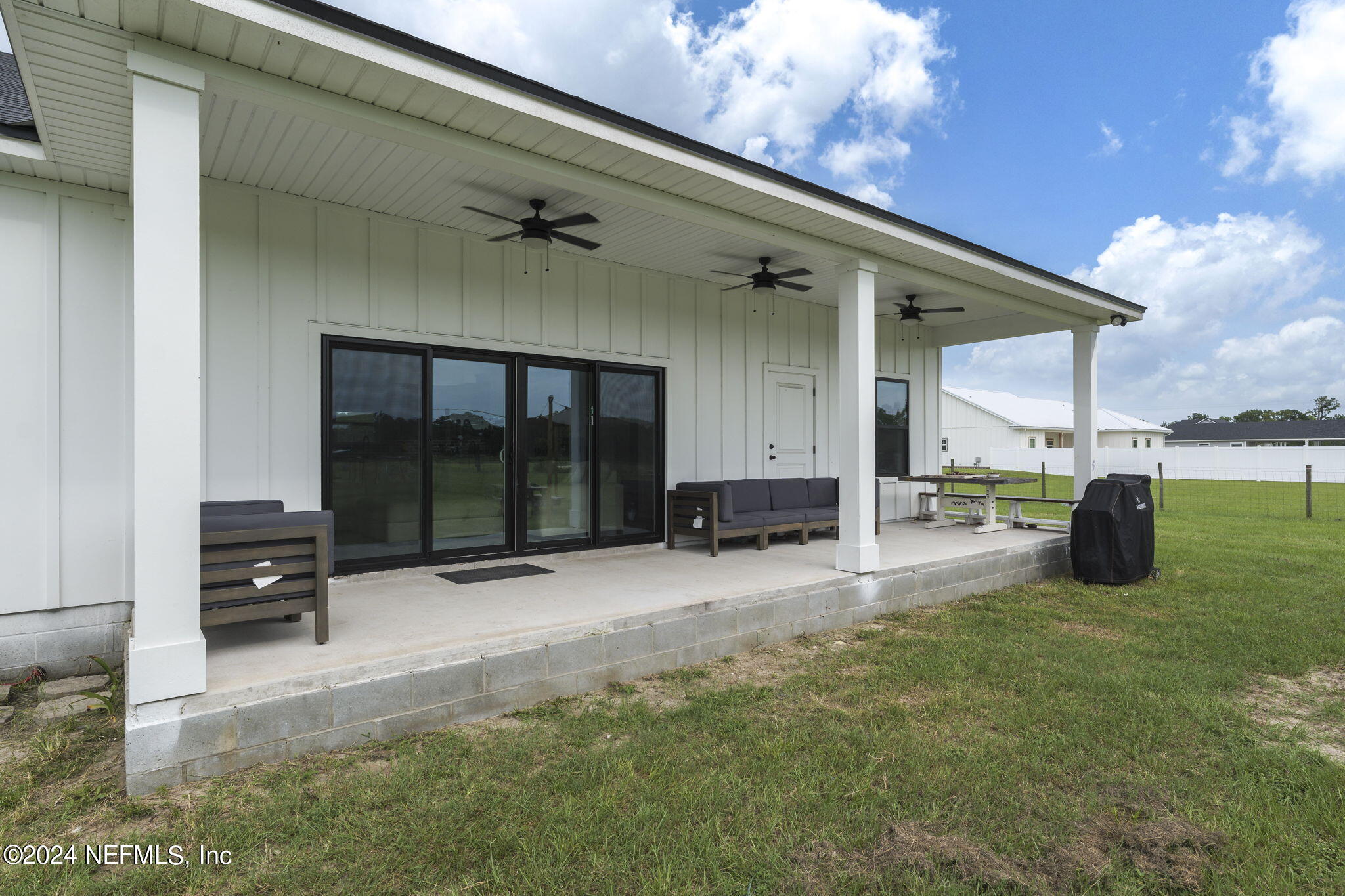 371270 Kings Ferry Road Hilliard, FL 32046 - Photo 34 of 45 Covered back porch with fans