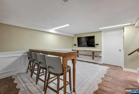 a view of a livingroom with furniture and wooden floor