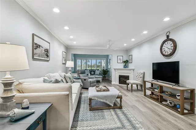 a spacious bedroom with a bed and a flat screen tv