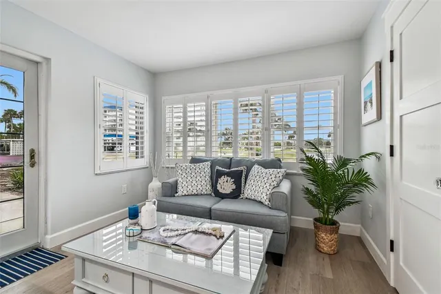 a bathroom with a granite countertop toilet sink and mirror