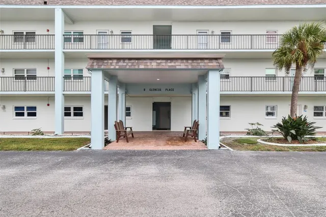 a kitchen with granite countertop a sink and a stove