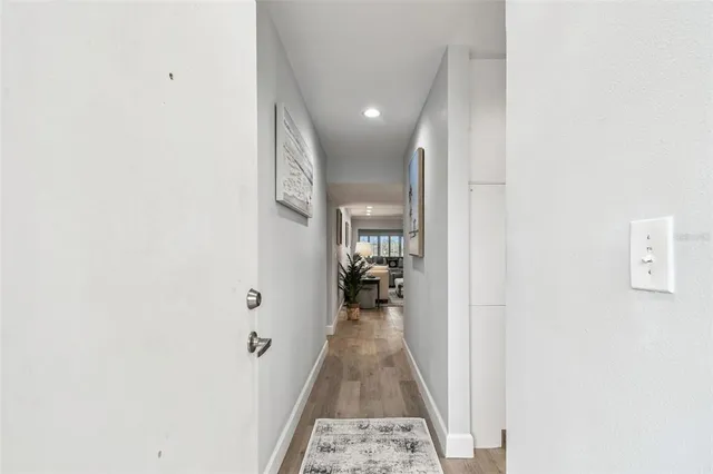 a kitchen with stainless steel appliances granite countertop a refrigerator sink and stove