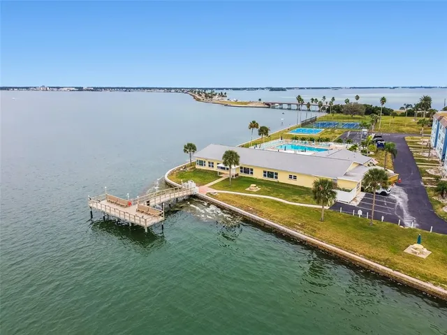 a view of a room with lots of furniture and a chandelier