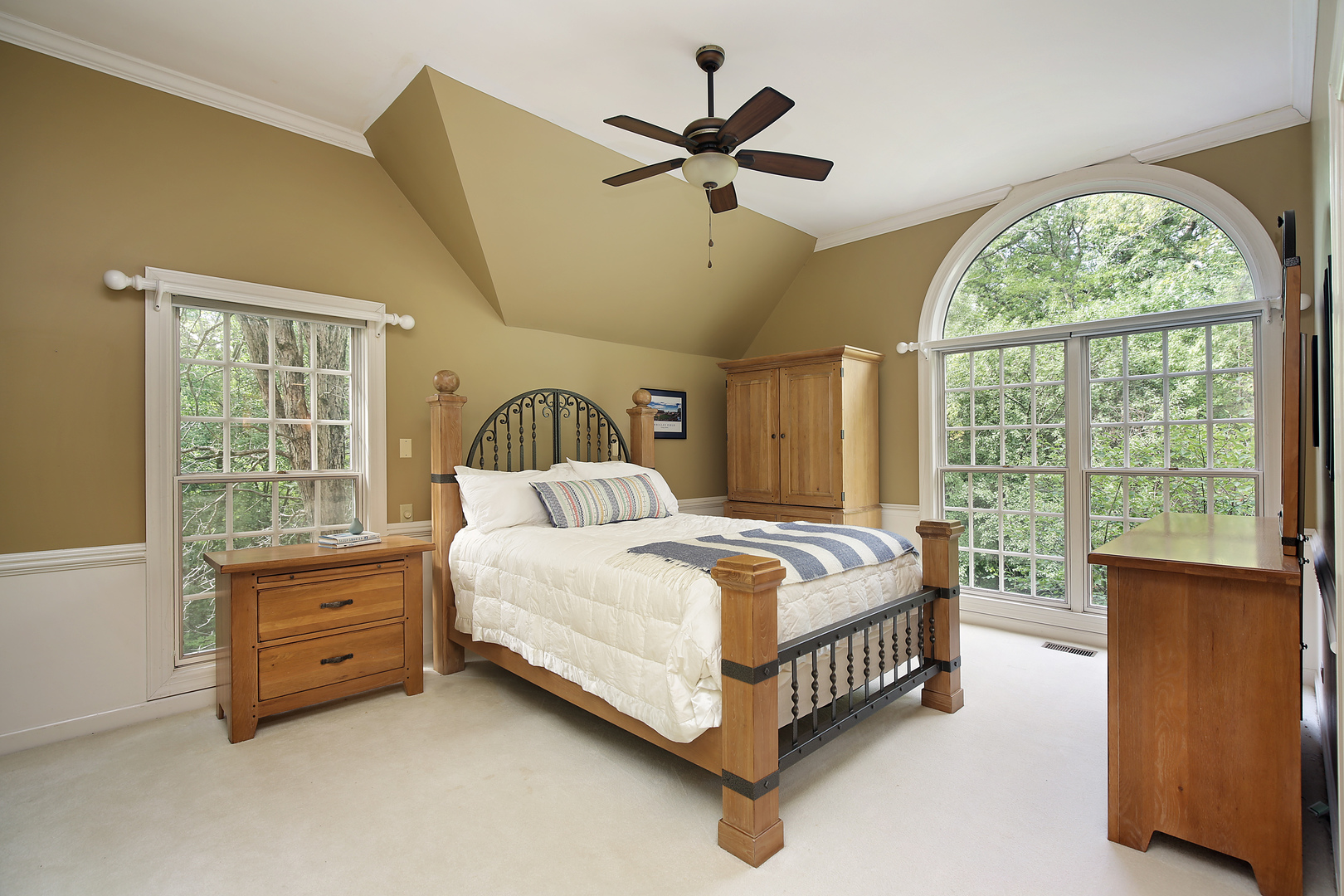 1565 South Ridge Road Lake Forest, IL 60045 - Photo 17 of 26 a bedroom with a bed and a large window