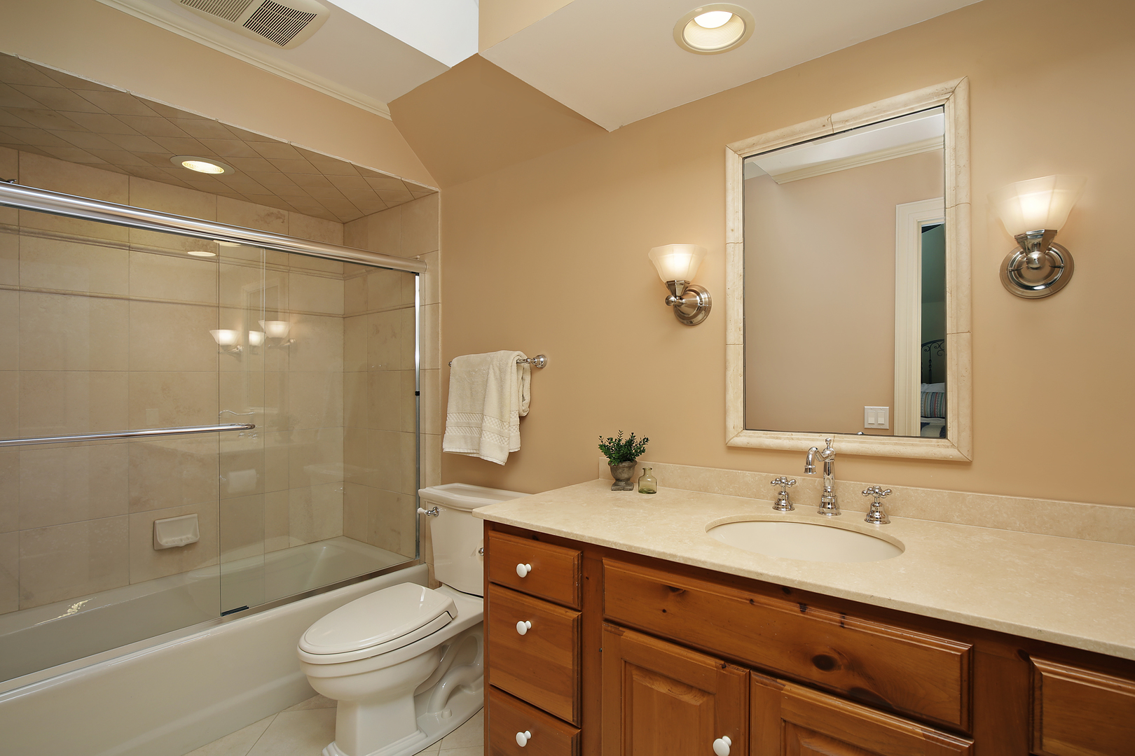 1565 South Ridge Road Lake Forest, IL 60045 - Photo 18 of 26 a bathroom with a granite countertop sink toilet and shower