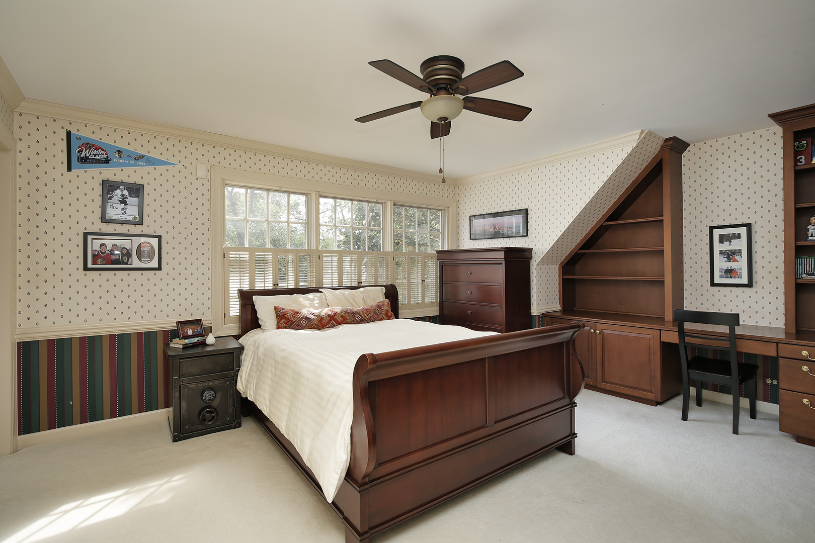 1565 South Ridge Road Lake Forest, IL 60045 - Photo 19 of 26 a bedroom with a bed and a chandelier