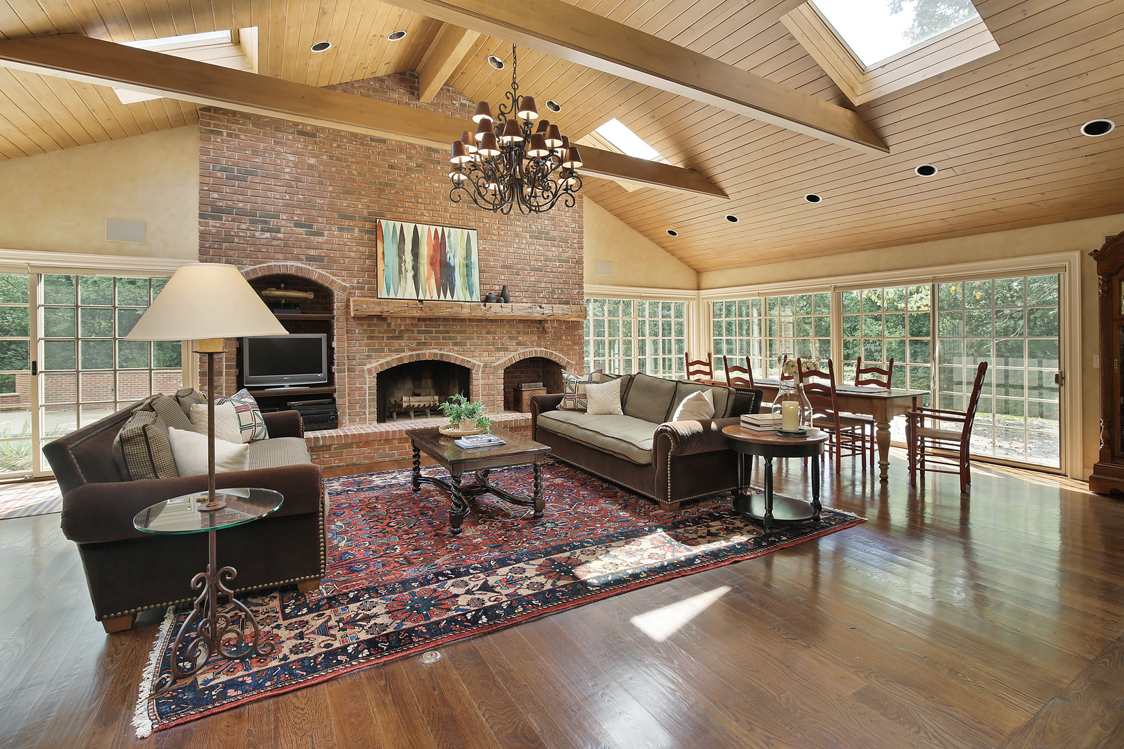 1565 South Ridge Road Lake Forest, IL 60045 - Photo 4 of 26 a living room with furniture dining table a fireplace and a large window