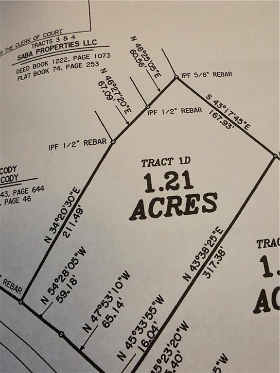 628 Robertson Loop Road Clarkesville, GA 30523 - Photo 3 of 6 a view of a book shelf with wooden floor