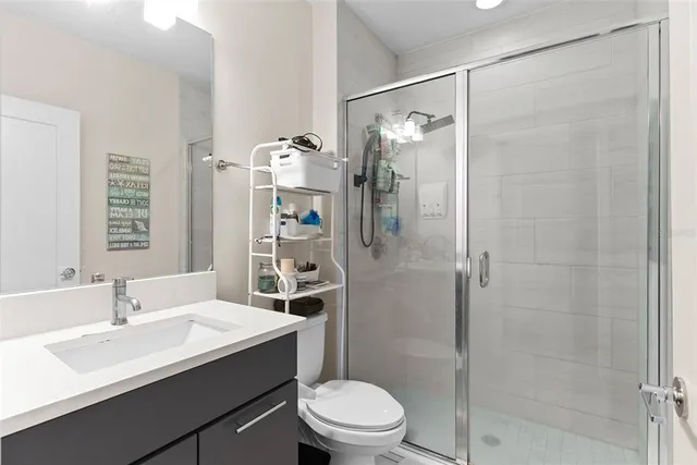 a view of a hallway with chair and a potted plant