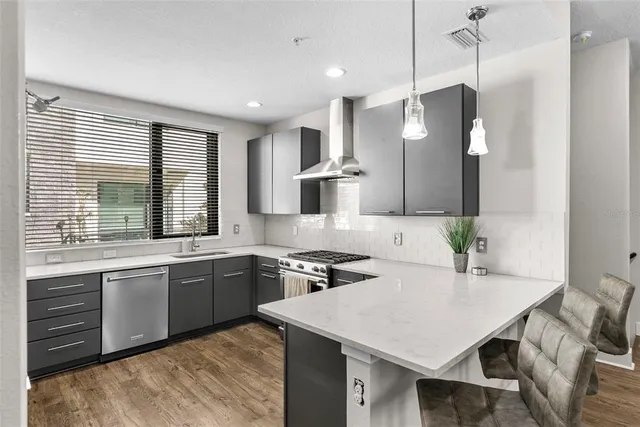 a kitchen with a stove and a sink