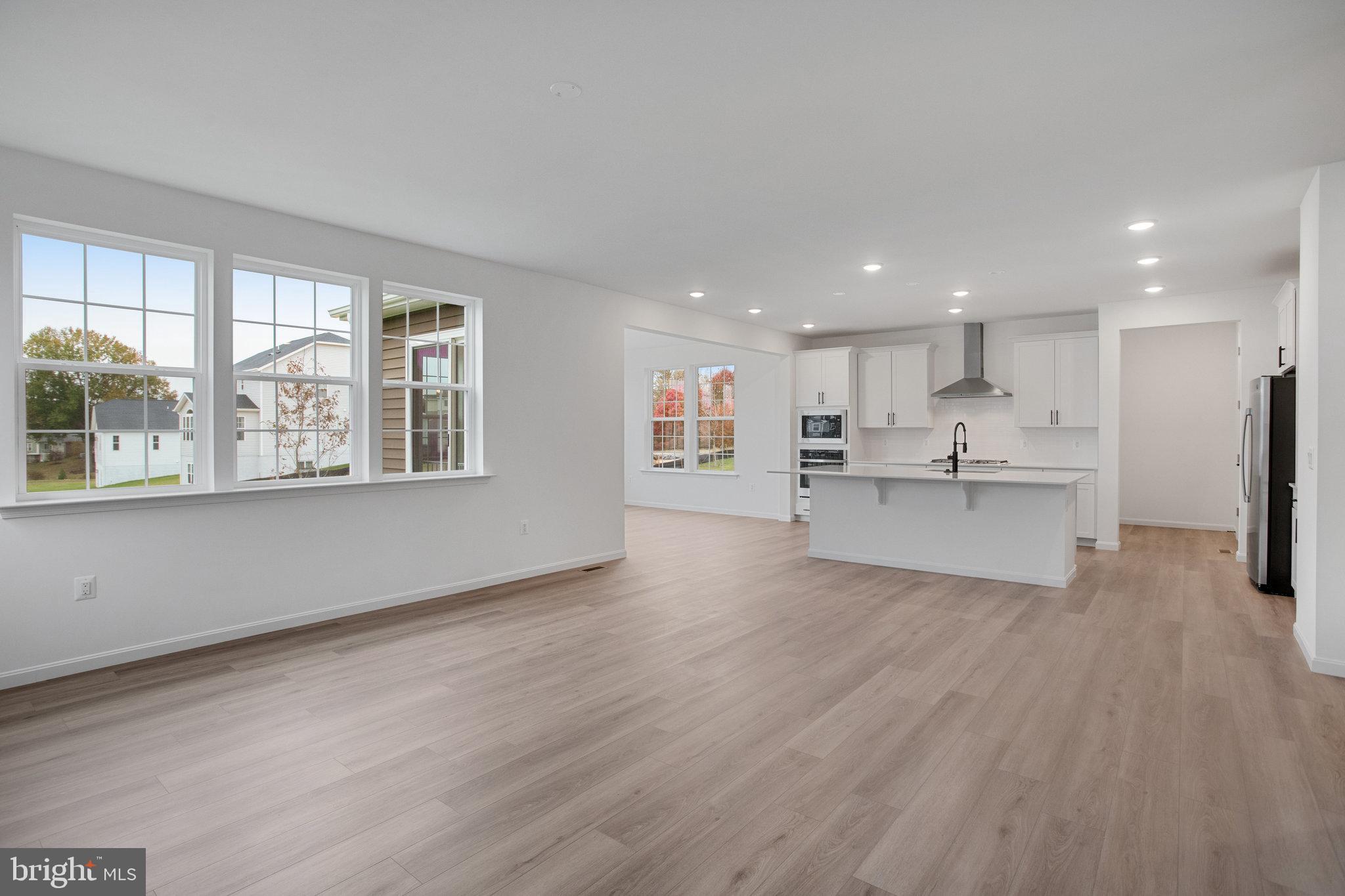 2009 Divot Drive Culpeper, VA 22701 - Photo 11 of 46 a view of kitchen with wooden floor and windows