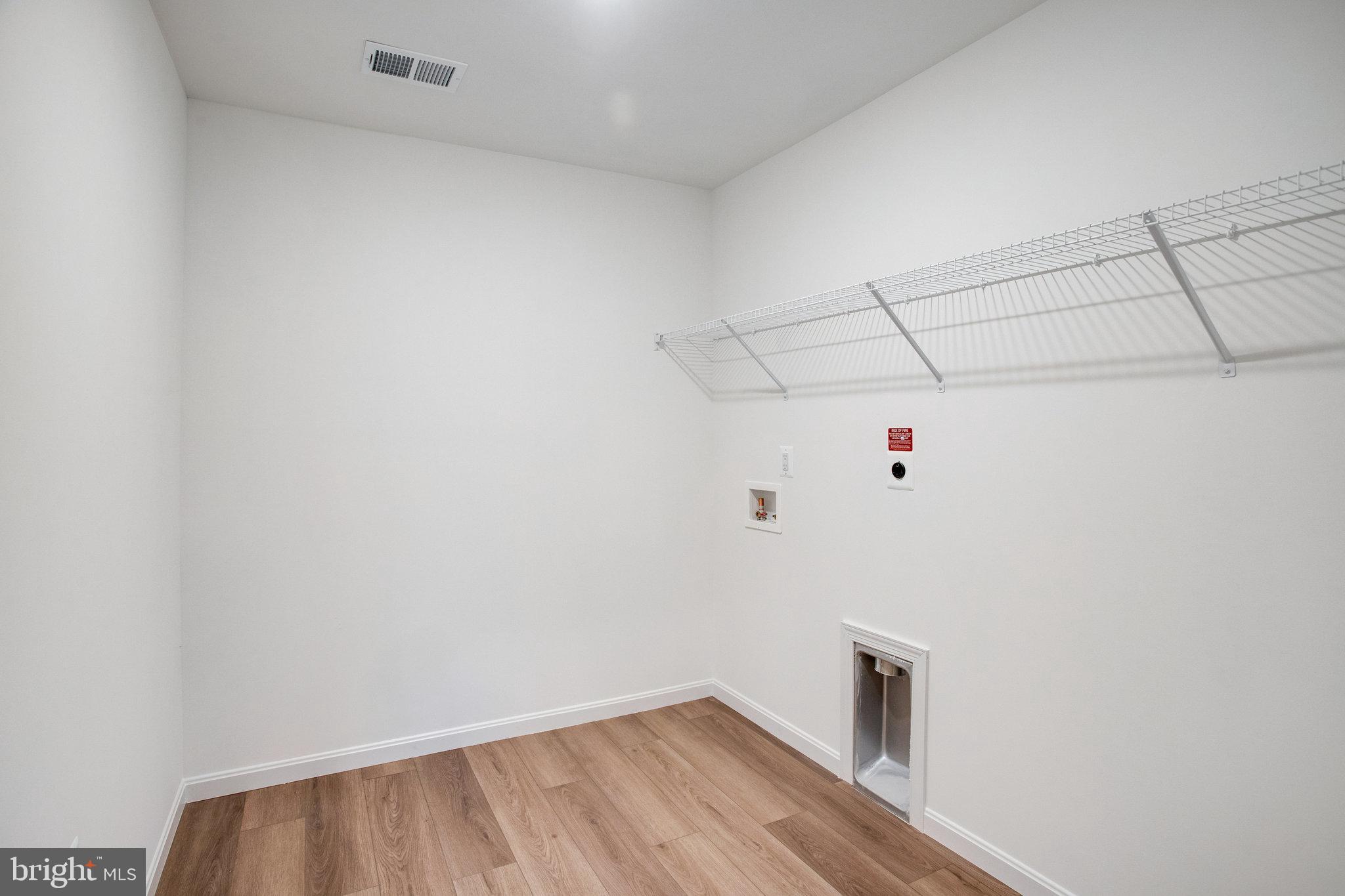 2009 Divot Drive Culpeper, VA 22701 - Photo 21 of 46 a view of a room with racks on the wall