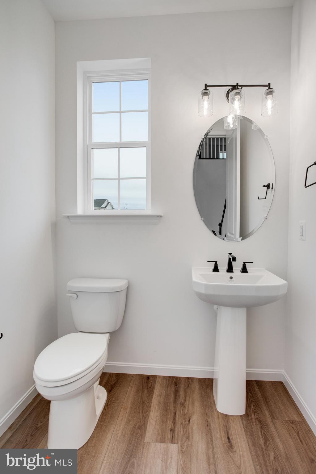2009 Divot Drive Culpeper, VA 22701 - Photo 8 of 46 a bathroom with a toilet sink and mirror
