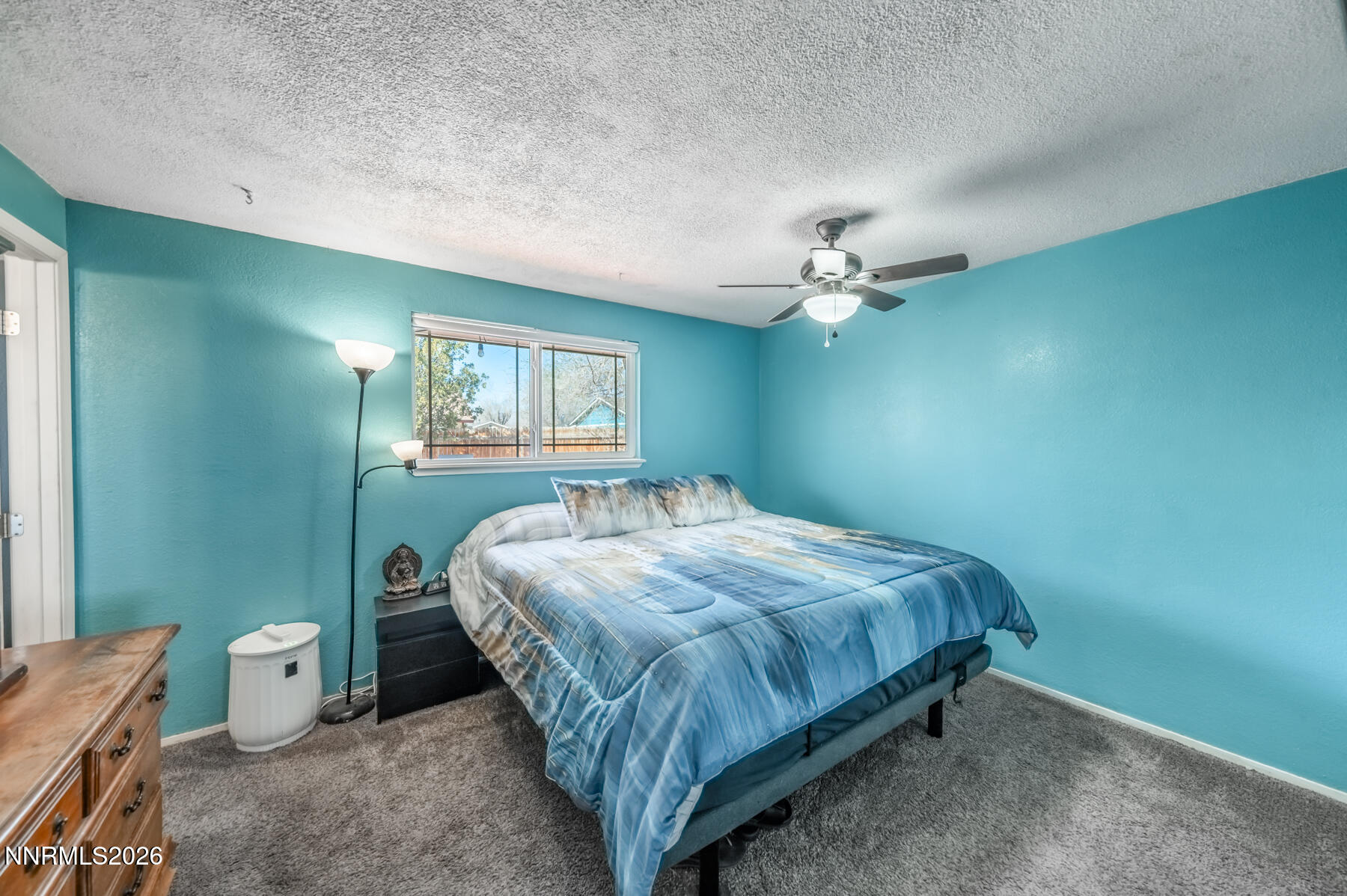 370 Maple Street Fernley, NV 89408 - Photo 15 of 32 a bedroom with a bed and a window