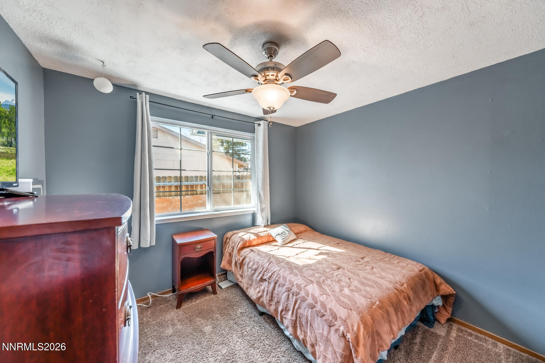 370 Maple Street Fernley, NV 89408 - Photo 18 of 32 a bedroom with a bed and window