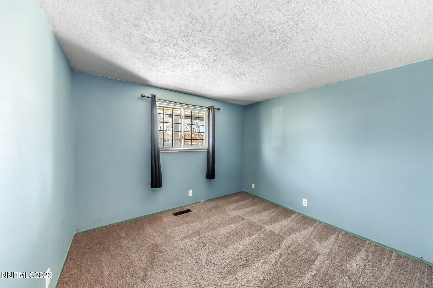 370 Maple Street Fernley, NV 89408 - Photo 19 of 32 a view of an empty room with a window