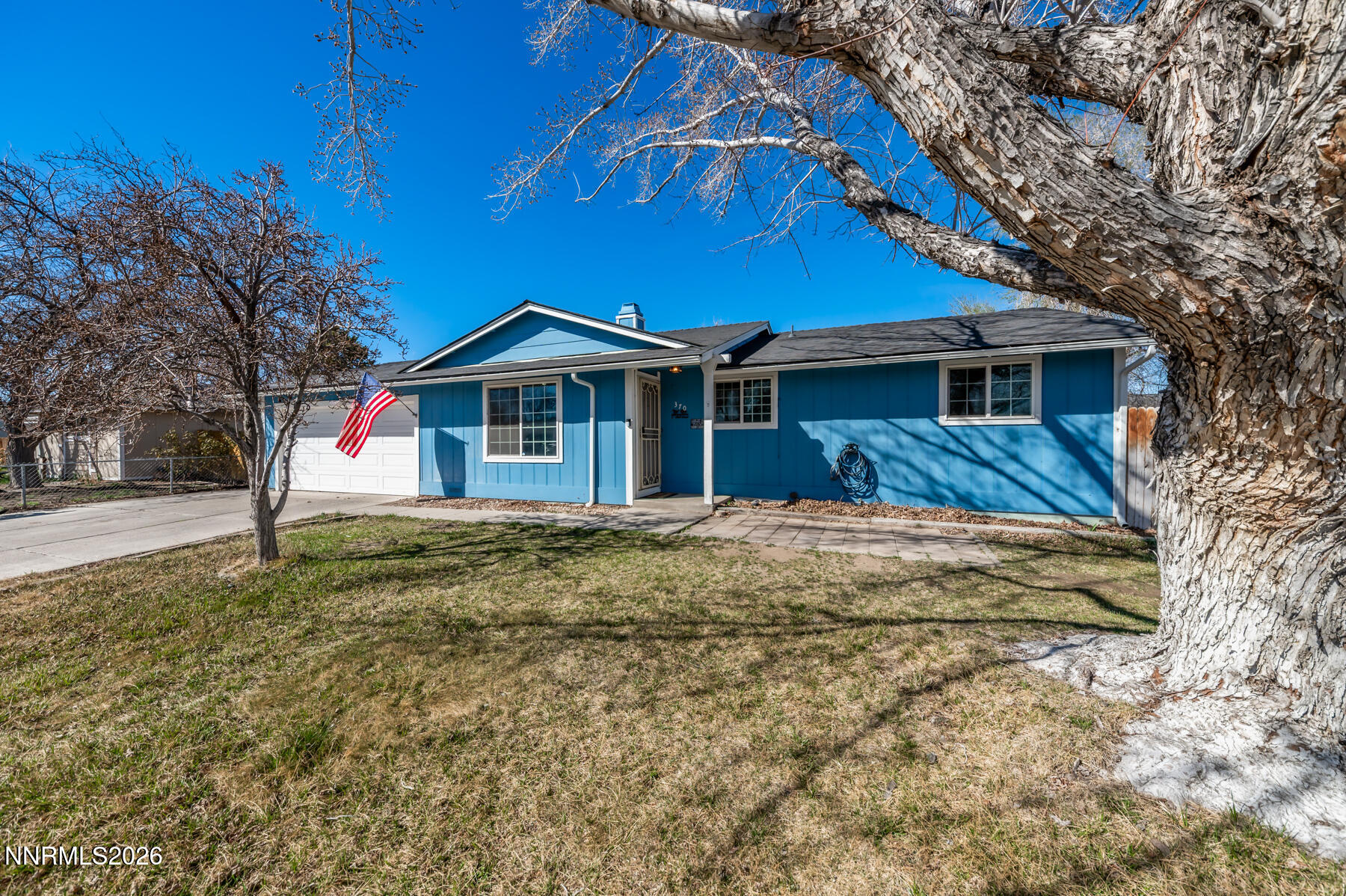370 Maple Street Fernley, NV 89408 - Photo 2 of 32 a front view of a house with a yard