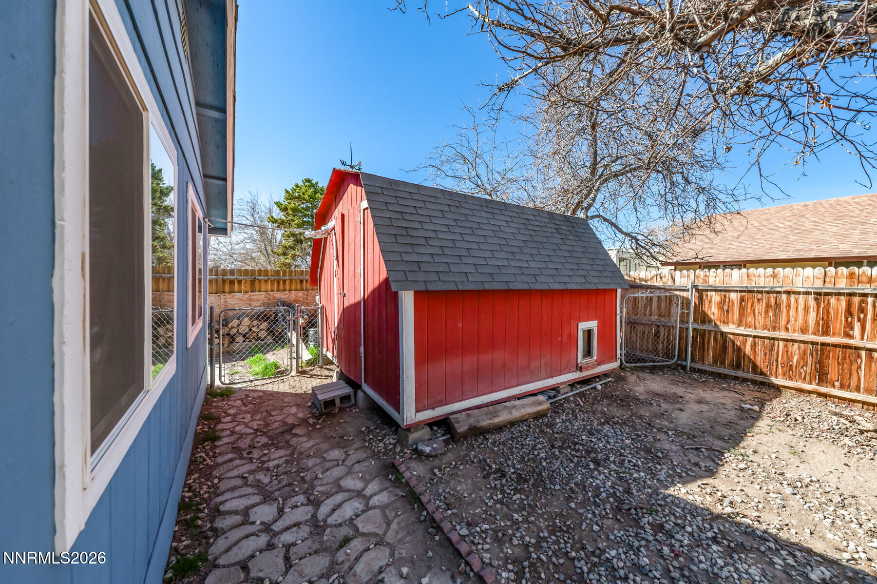 370 Maple Street Fernley, NV 89408 - Photo 25 of 32 a view of a backyard with a trees