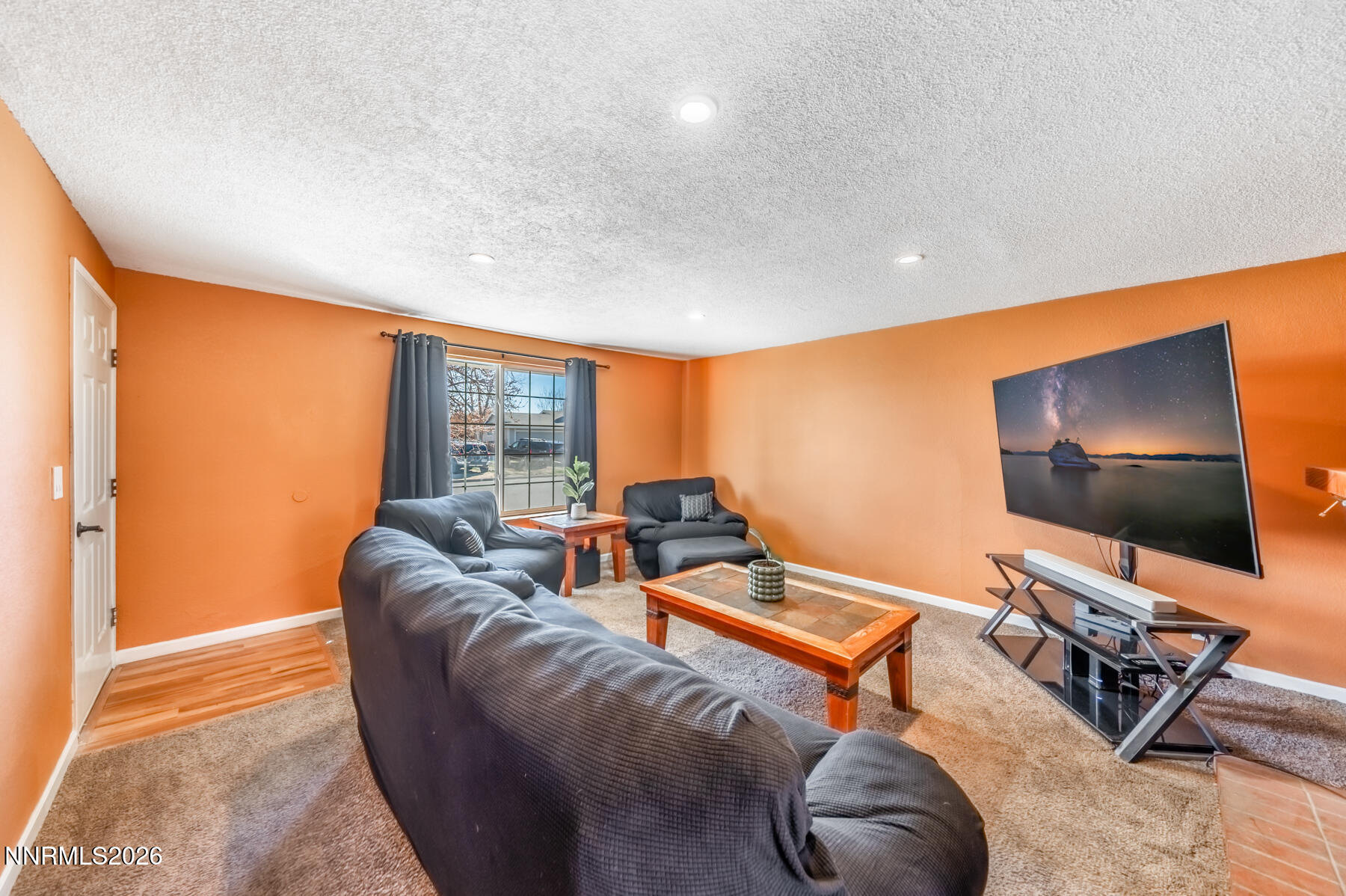 370 Maple Street Fernley, NV 89408 - Photo 8 of 32 a living room with furniture and a flat screen tv
