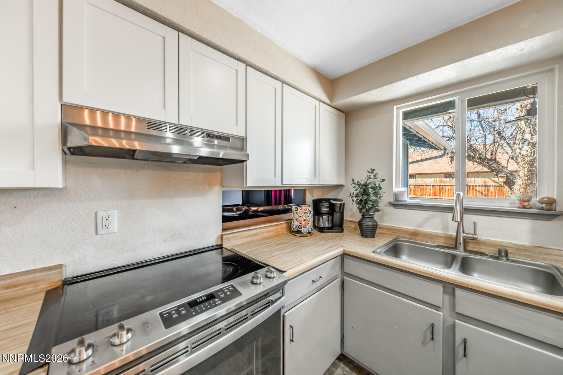 370 Maple Street Fernley, NV 89408 - Photo 10 of 32 a kitchen with a sink appliances and cabinets
