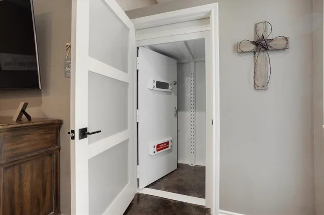 a view of a room with a door and wooden door