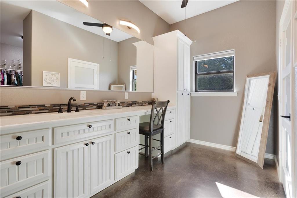 7250 North Fm 273 Ivanhoe, TX 75447 - Photo 15 of 40 a spacious bathroom with a granite countertop sink and a mirror