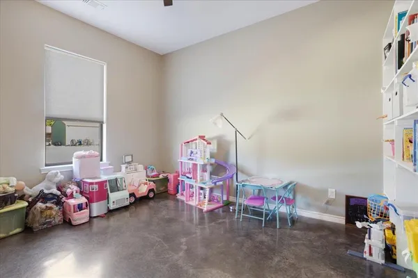 a bedroom with furniture and a window