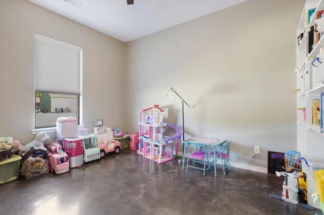 a bedroom with furniture and a window