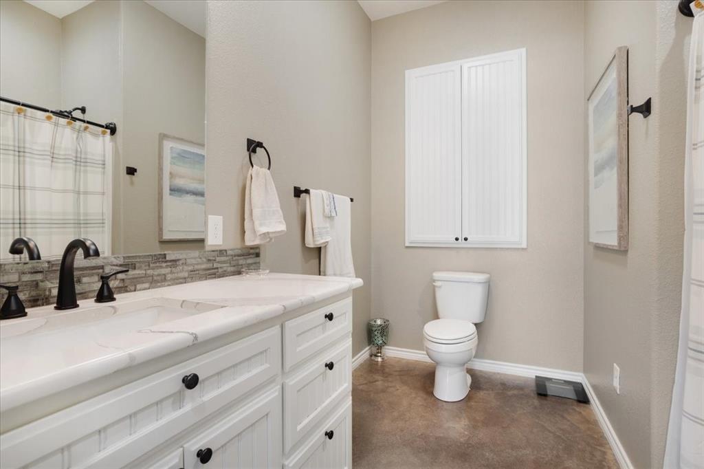7250 North Fm 273 Ivanhoe, TX 75447 - Photo 19 of 40 a bathroom with a sink toilet and shower