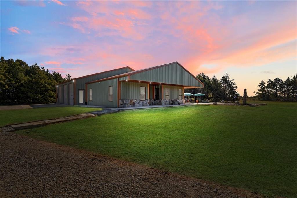 7250 North Fm 273 Ivanhoe, TX 75447 - Photo 2 of 40 a front view of a house with garden