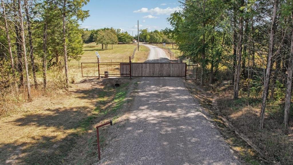 7250 North Fm 273 Ivanhoe, TX 75447 - Photo 27 of 40 a view of backyard with wooden fence