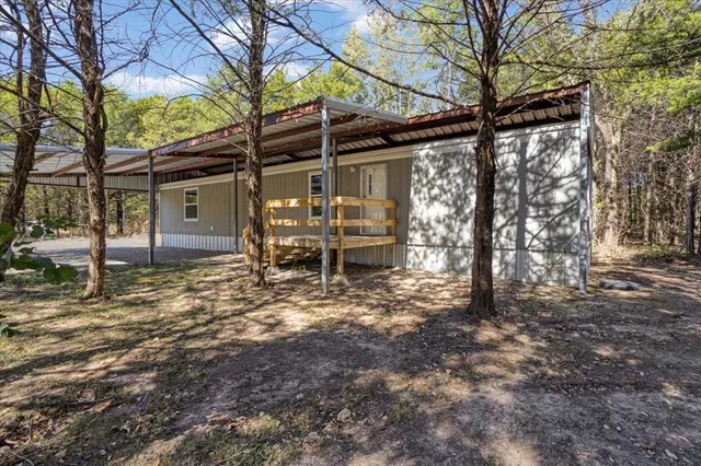 an aerial view of a houses with outdoor space