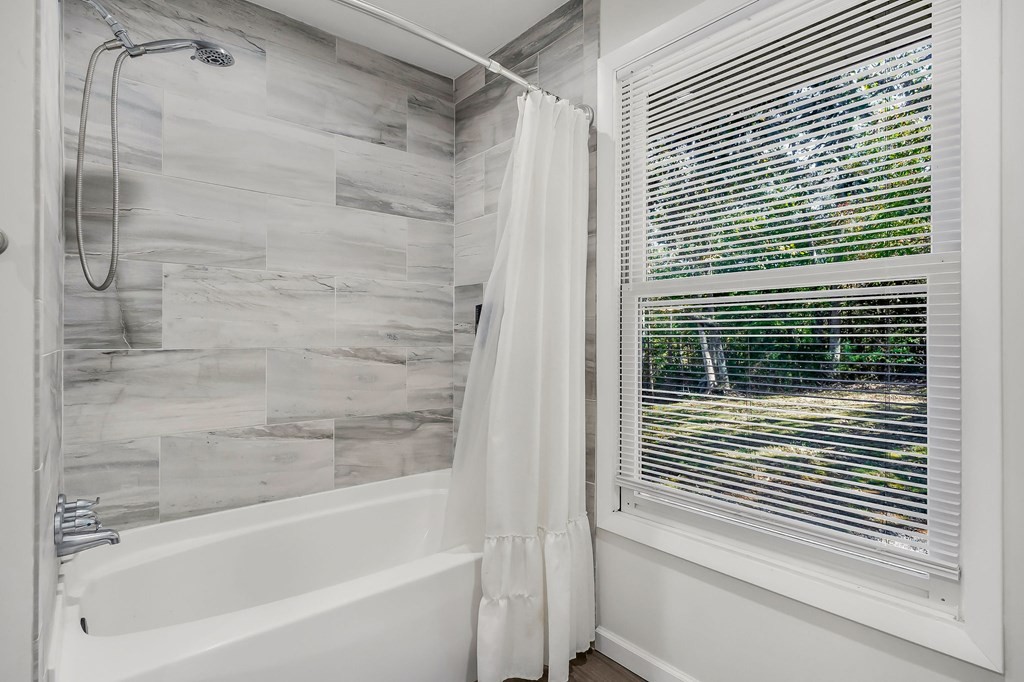 209 Lankford Road Cookeville, TN 38506 - Photo 21 of 38 a bathroom with a bathtub and a shower