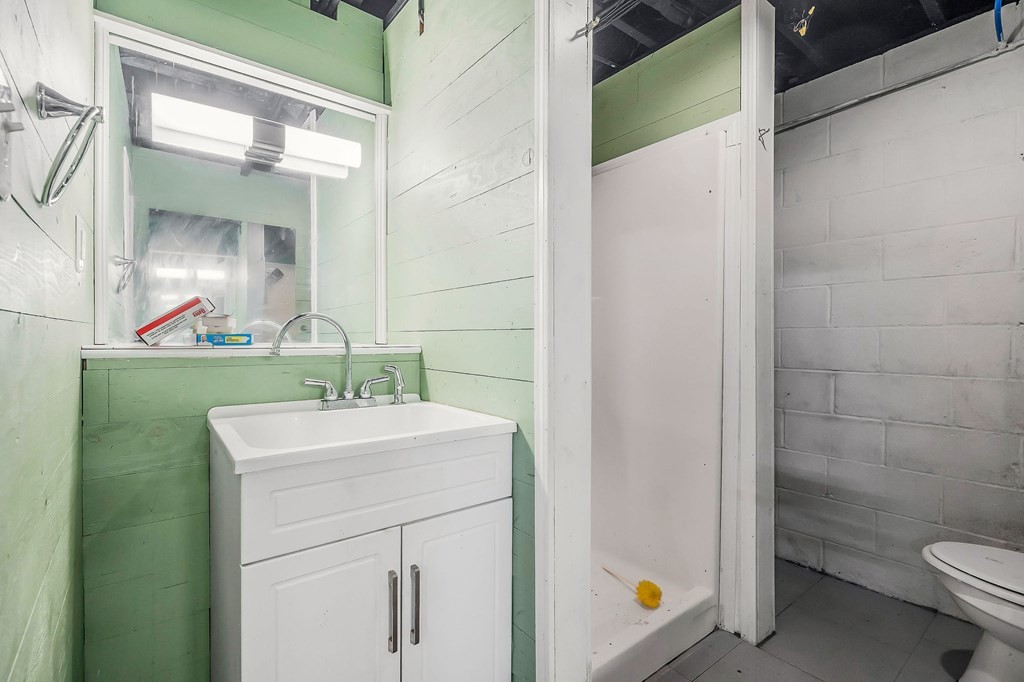 209 Lankford Road Cookeville, TN 38506 - Photo 25 of 38 a bathroom with a sink a toilet and shower