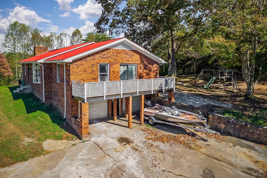 209 Lankford Road Cookeville, TN 38506 - Photo 29 of 38 a view of house with a yard