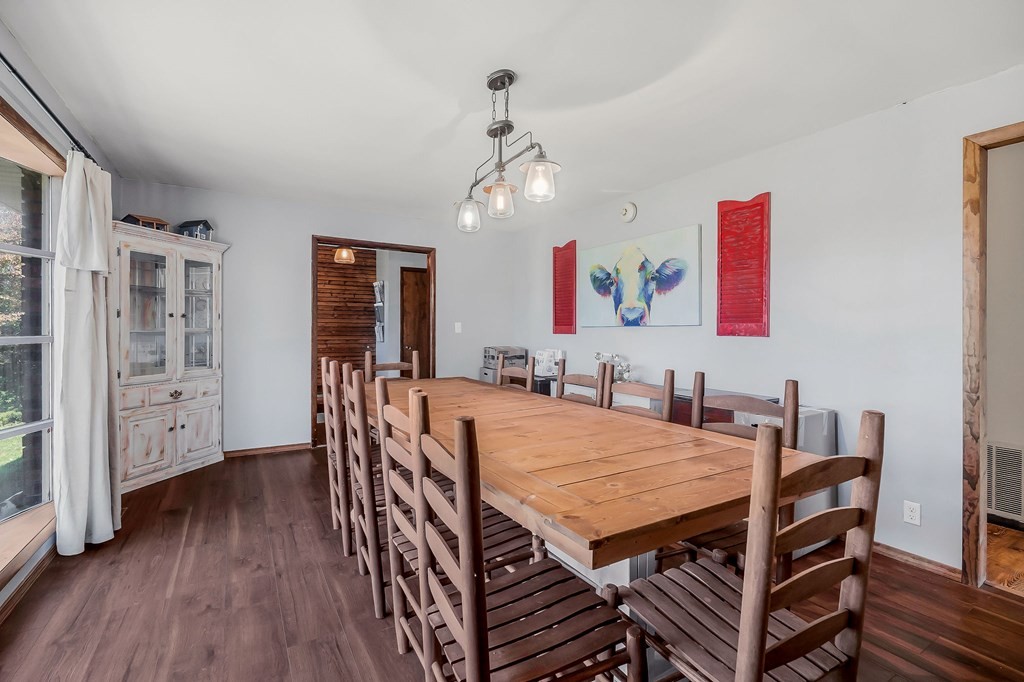 209 Lankford Road Cookeville, TN 38506 - Photo 9 of 38 a view of a dining room with furniture and wooden floor