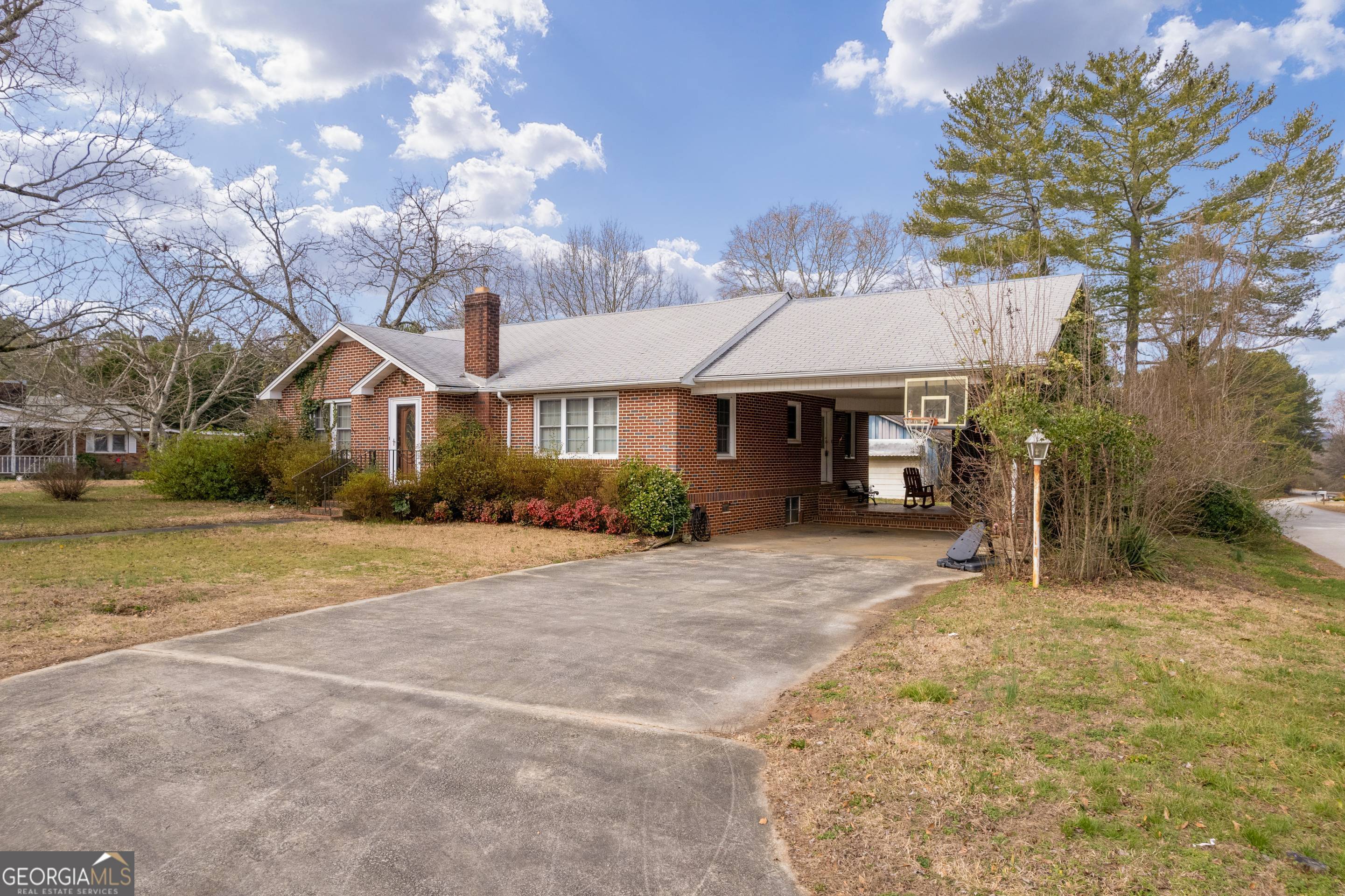 1524 Mize Road Toccoa, GA 30577 - Photo 1 of 1 a front view of a house with a yard and garage